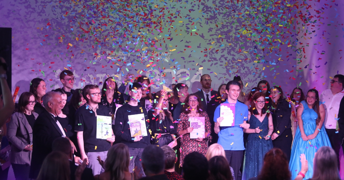 Our Stars of 2024 stood celebrating on stage