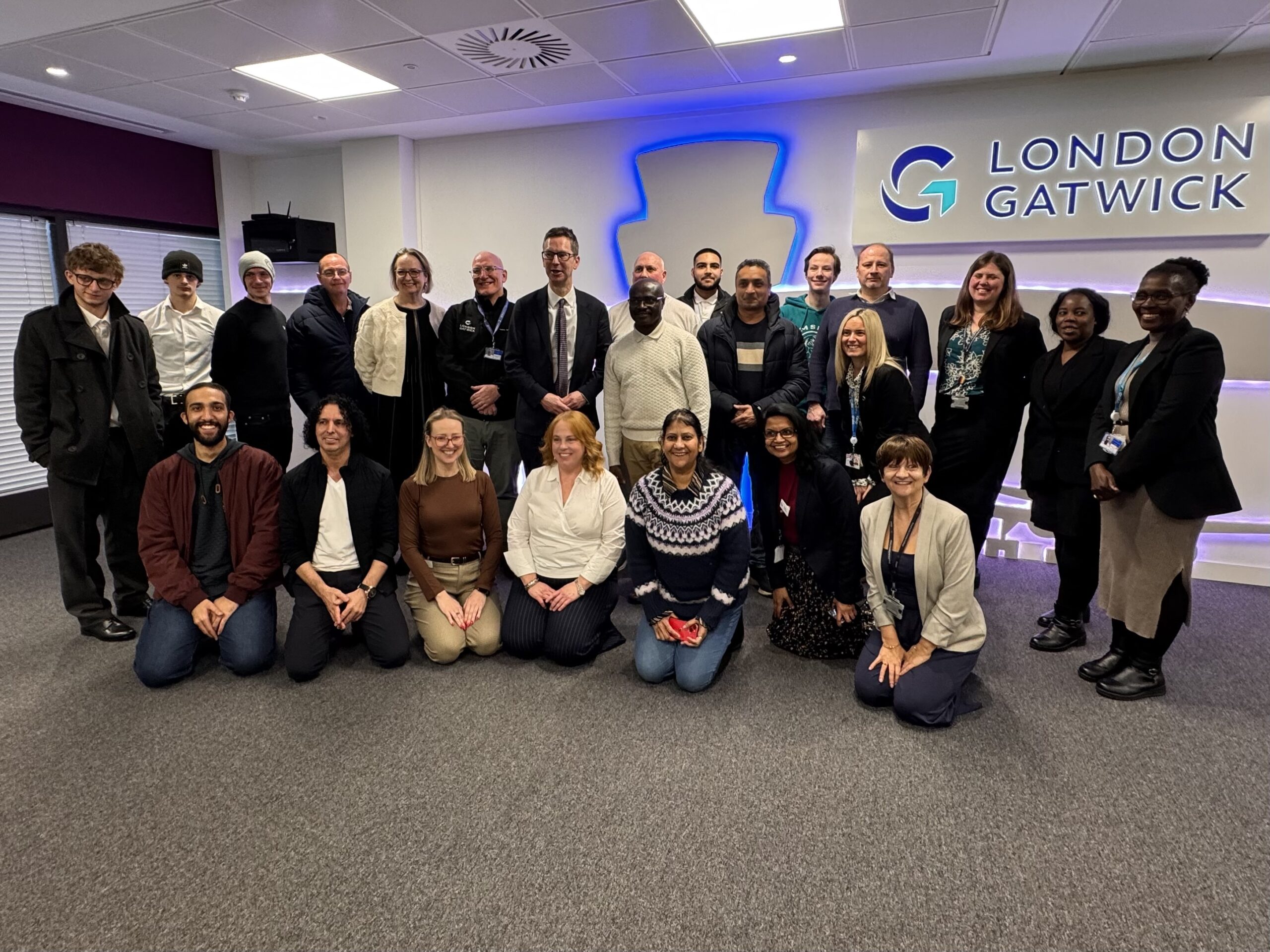 Our first cohort of students stood for a photo with Sir Peter Schofield, Permanent Secretary at the DWP