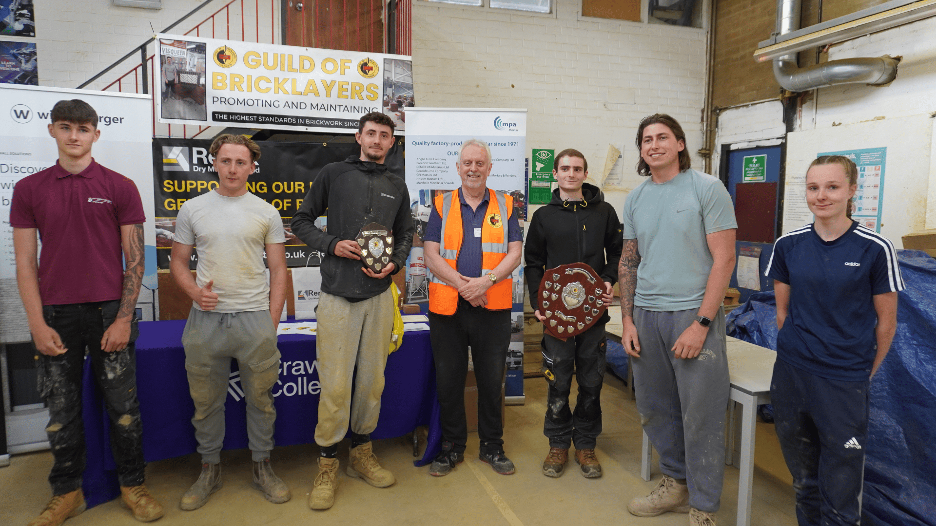 The top 3 students from each category stood with representatives from the Guild of Bricklayers